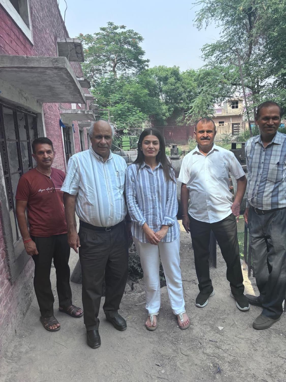 SURA Group leadership with the site team during a facility visit